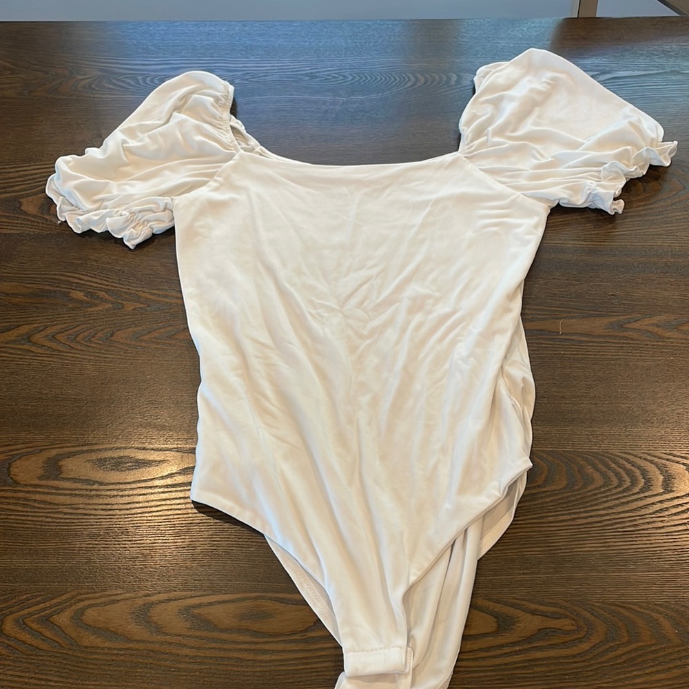 White bodysuit with ruffle sleeves from Pink Lily